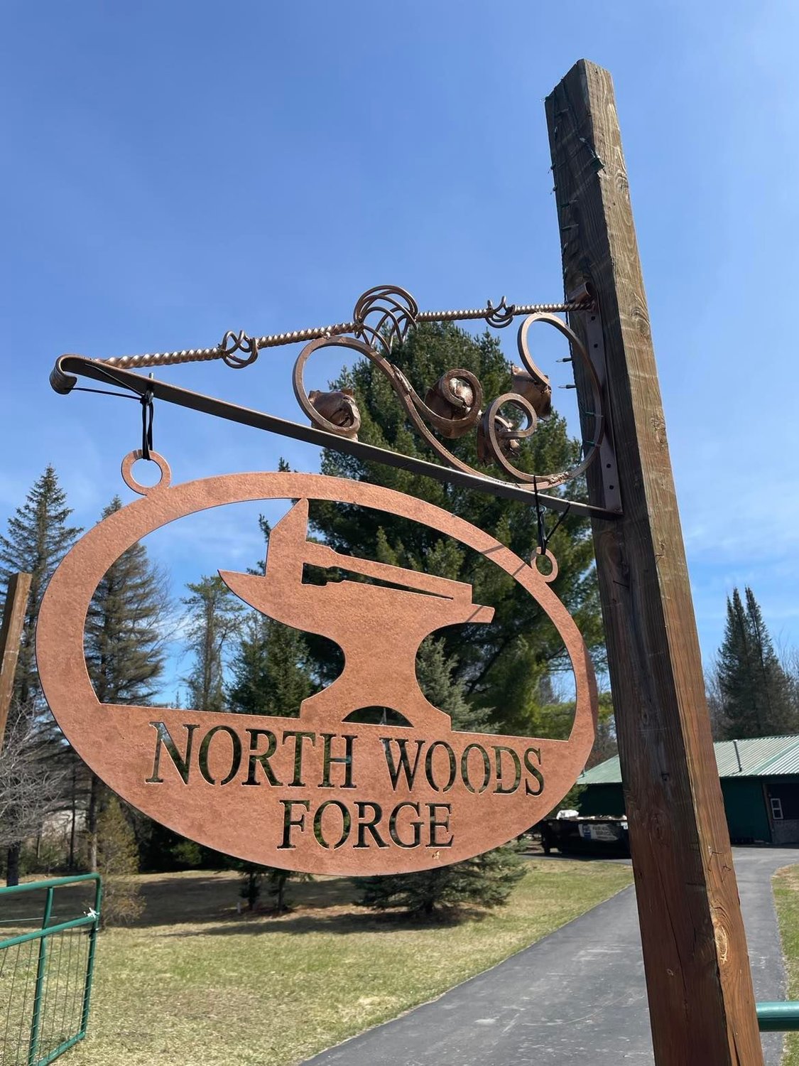 Made by owner David McConnell, this sign hangs in front of the new business North Woods Forge, north of Harrison.